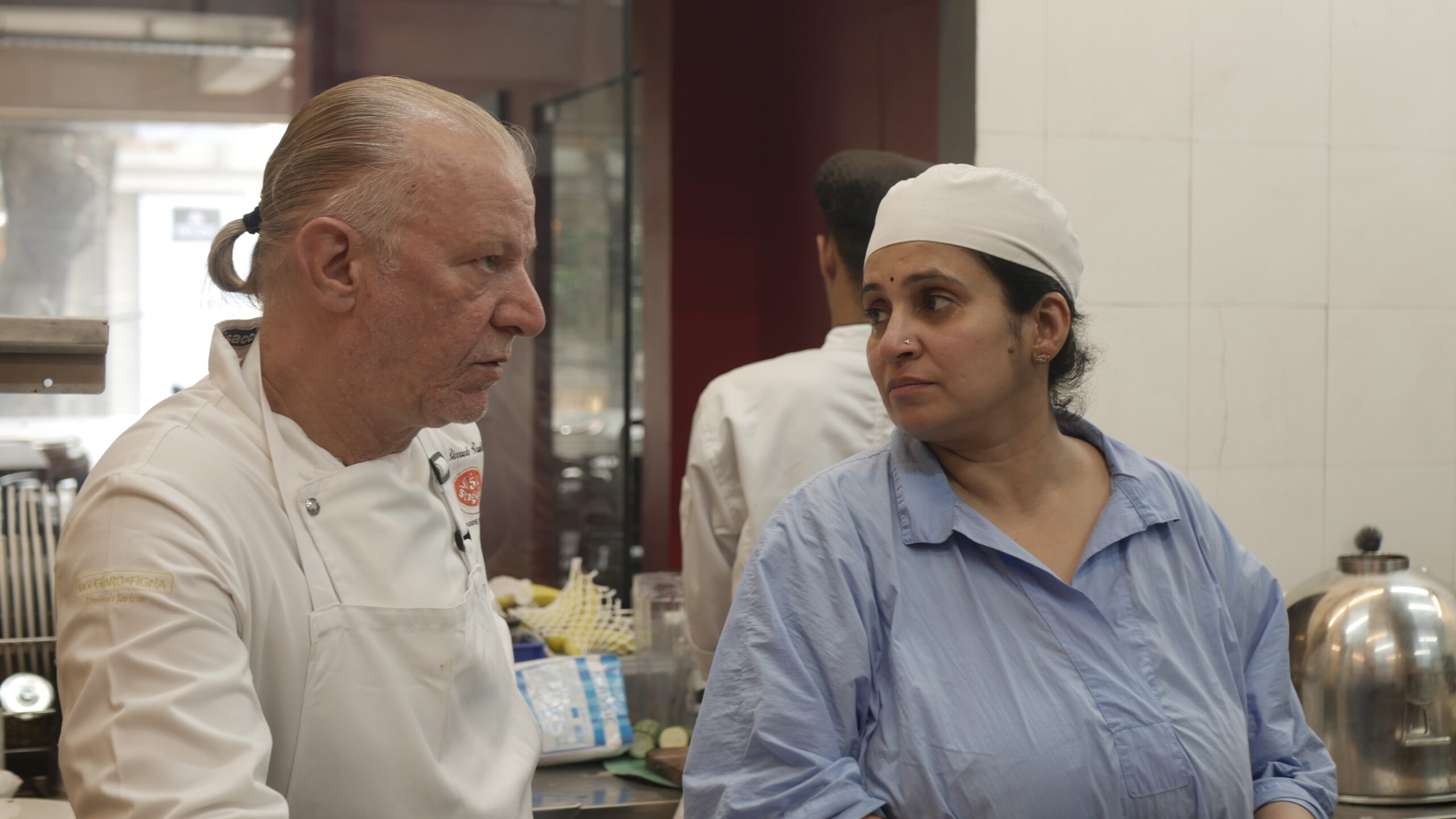 Chef Riccardo training Niharika Peri in the pala technique