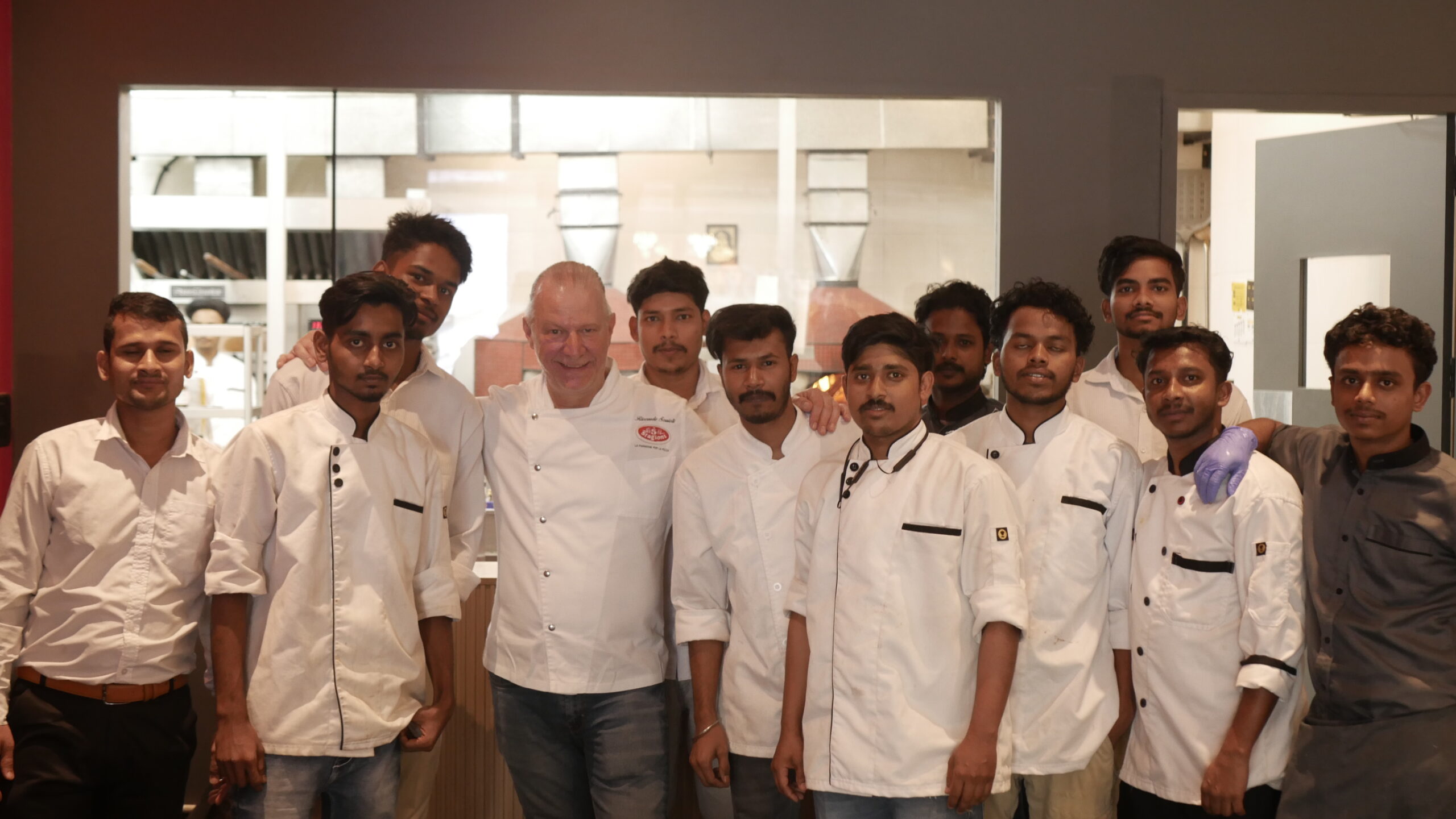 Chef Riccardo with the Eatinn' Love Trattoria team